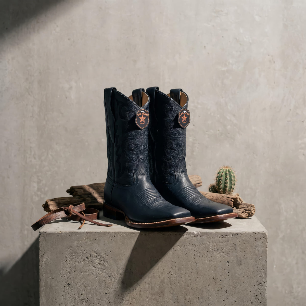 Los Altos Boots Men’s Rodeo Boot — Black, concrete plinth, at eye level, centered